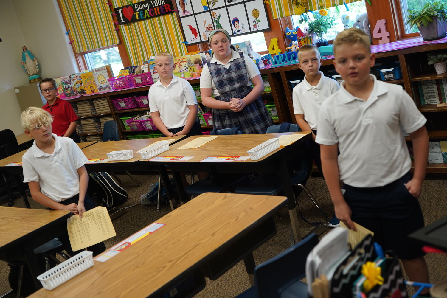 Fourth-graders at St. Mary School start their first day with morning prayers.